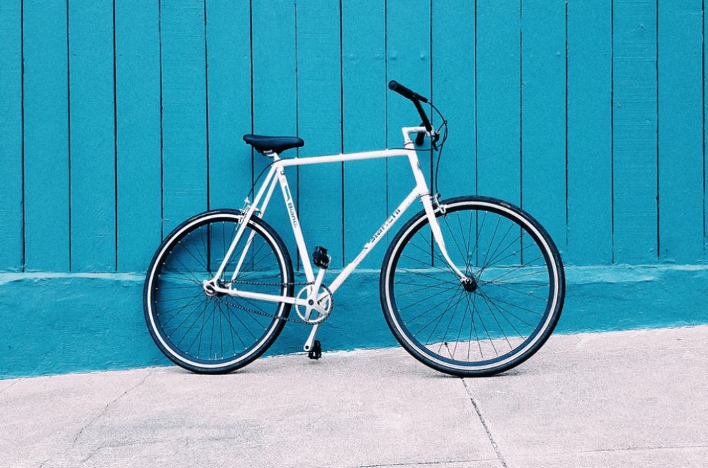 sport coordinator bicycle against blue background