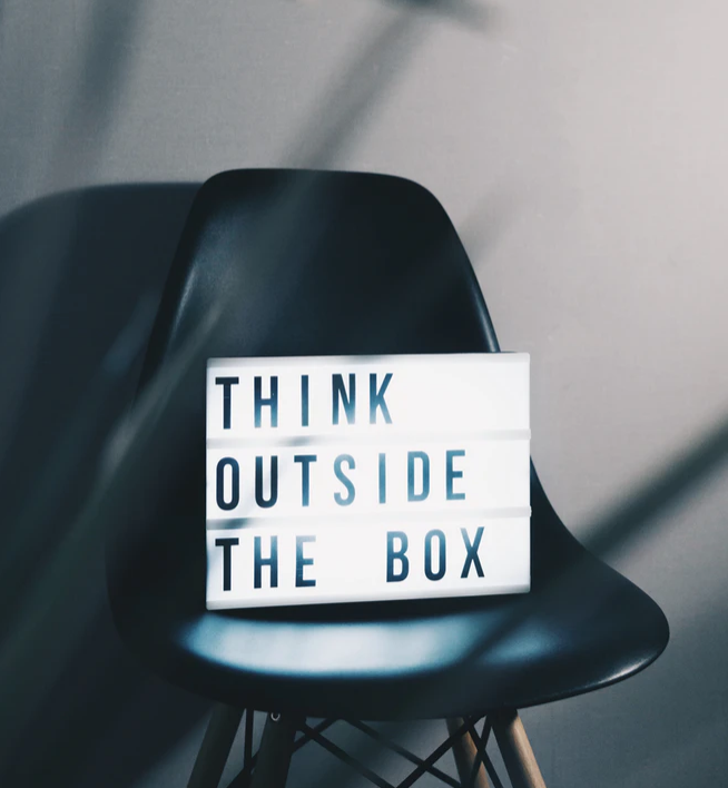 think outside the box sign on a chair, Canada’s Next Top Ad Exec